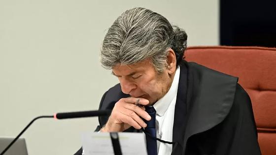 O ministro do STF Luiz Fux durante o voto da ministra Cármen Lúcia no julgamento da trama golpista.