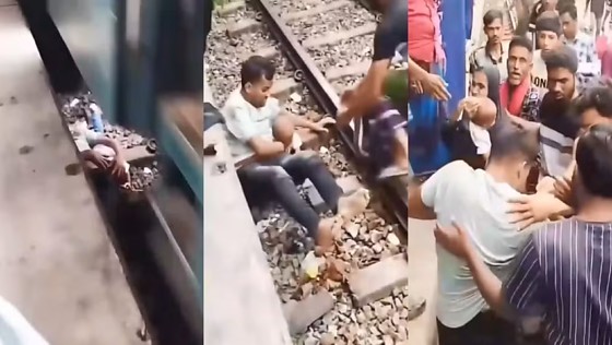 Sem alternativa diante da chegada da locomotiva com vários vagões, pai e filho se deitaram entre os trilhos para evitar serem atingidos.